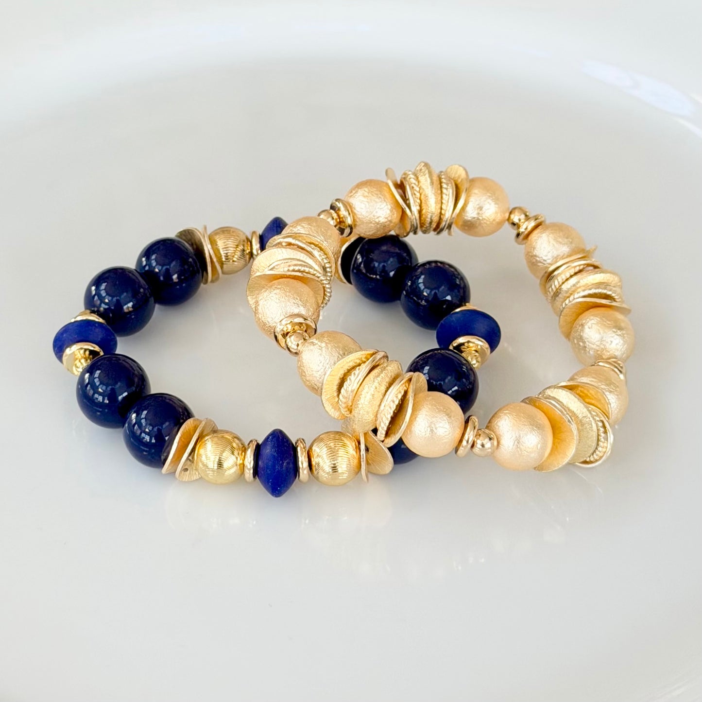 NAVY BLUE BANGLE WITH GOLD WAVY DISC AND NAVY ACCENTS