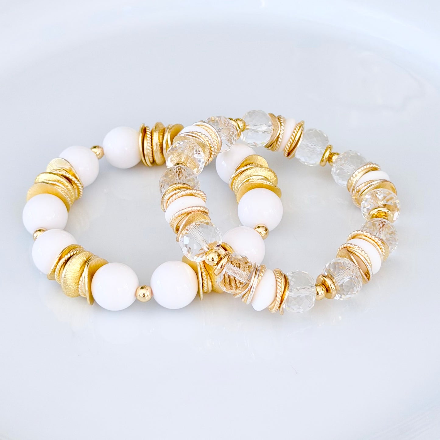 FACETED LUCITE BANGLE WITH GOLD, WAVY DISC AND WHITE ACCENTS