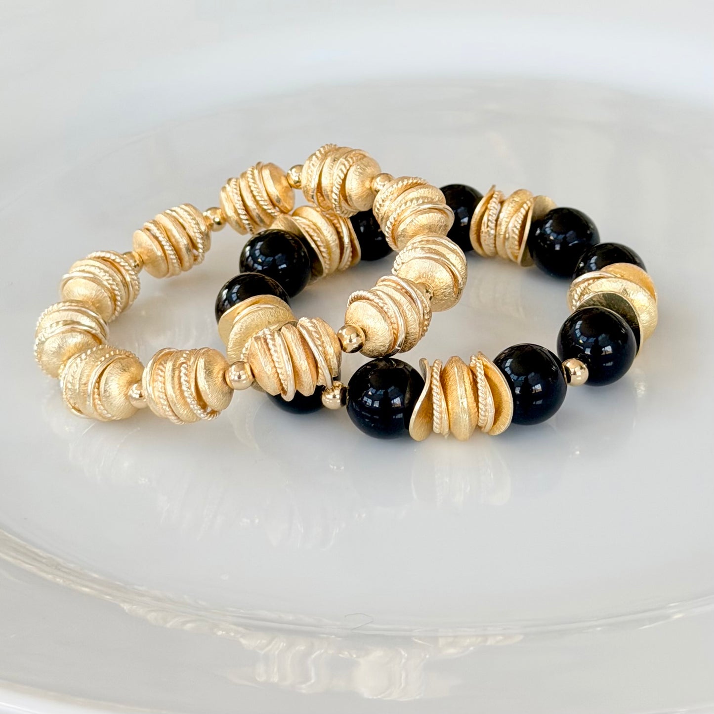 NAVY BLUE BANGLE WITH BRUSHED GOLD WAVY DISC AND GOLD ACCENTS