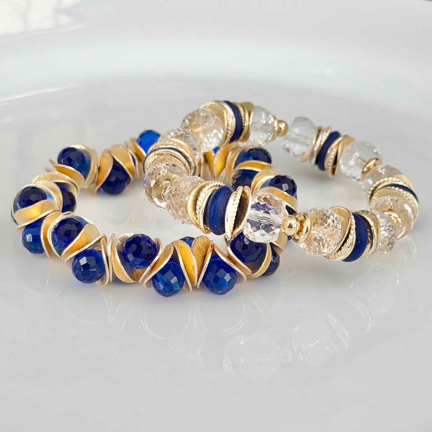 GOLD WAVY DISC AND BLUE FACETED BRIOLETTE BANGLE