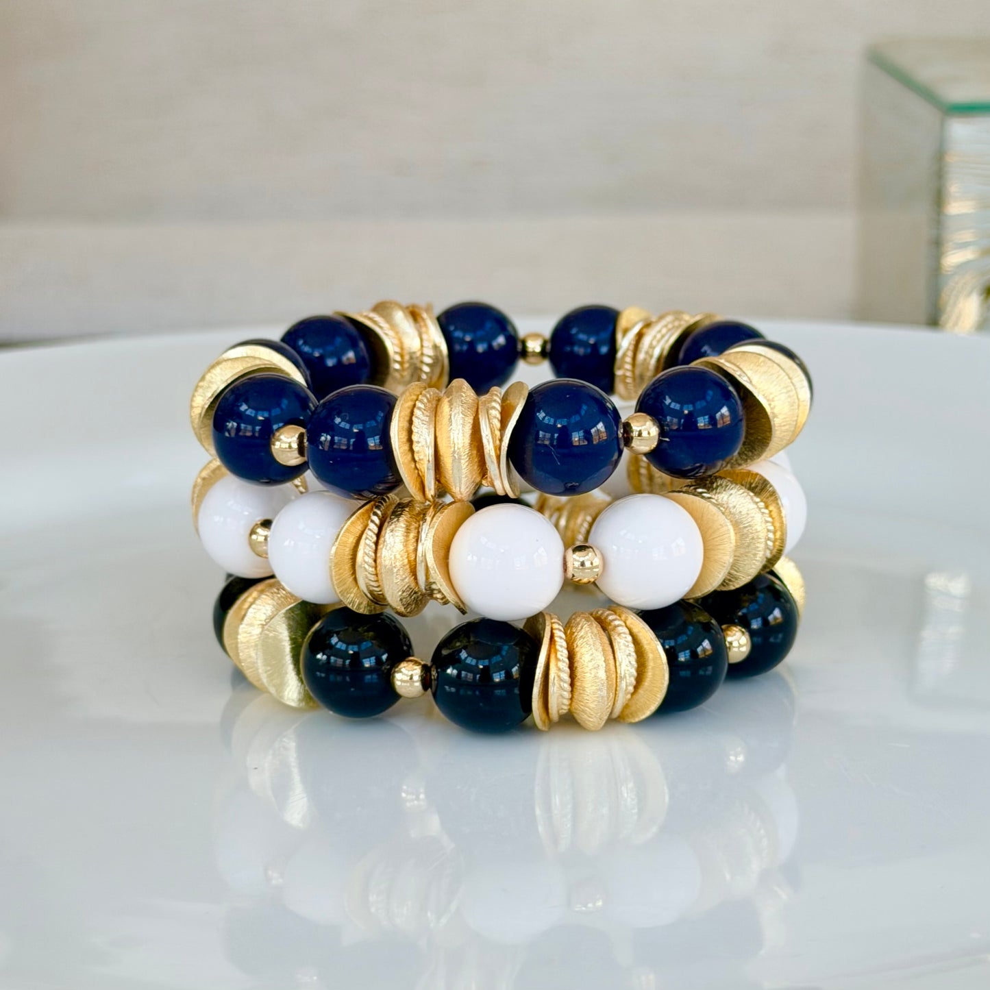 BLACK AND GOLD WAVY DISC BANGLE WITH BRUSHED GOLD ACCENTS