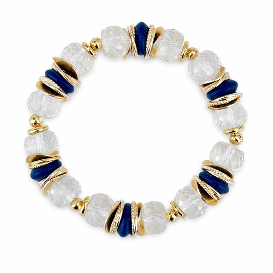 FACETED LUCITE BANGLE WITH GOLD, WAVY DISC AND NAVY BLUE ACCENTS