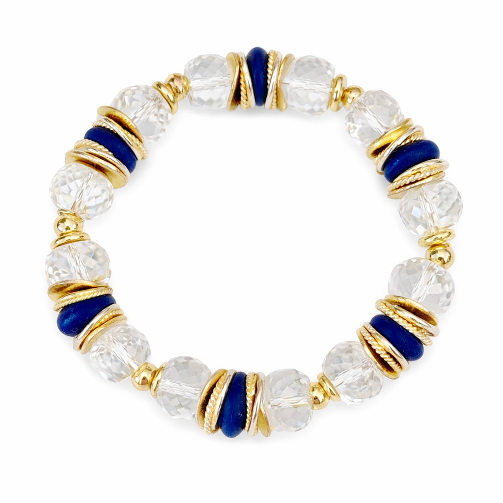 FACETED LUCITE BANGLE WITH GOLD, WAVY DISC AND NAVY BLUE ACCENTS