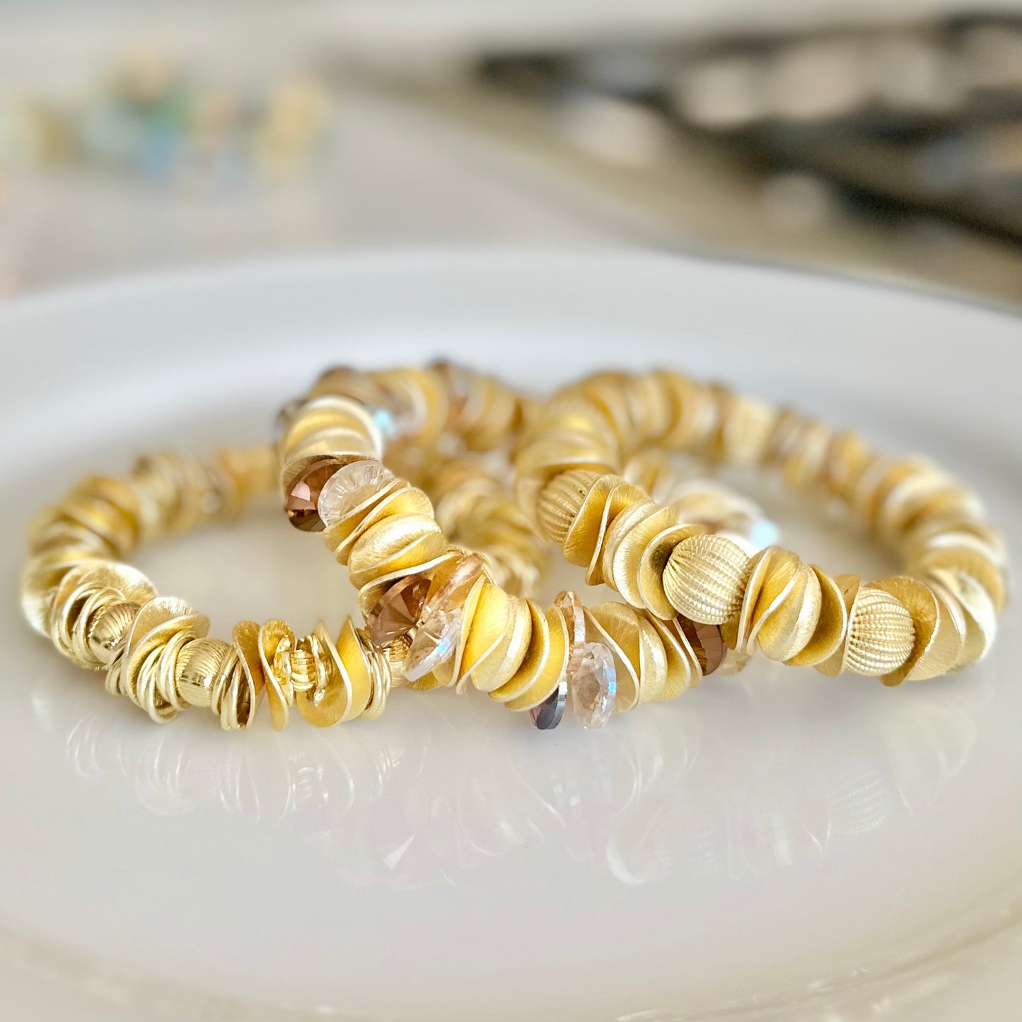 GOLD WAVY DISC AND CORRUGATED STATEMENT BRACELET