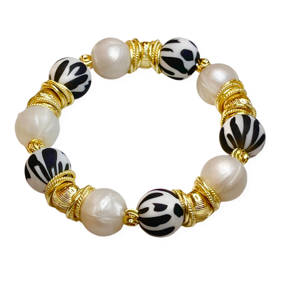 BLACK AND IVORY COW PATTERN BANGLE WITH GOLD ACCENTS
