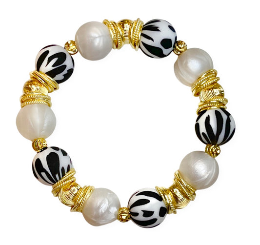 BLACK AND WHITE COW PATTERN BANGLE WITH WHITE AND GOLD ACCENTS