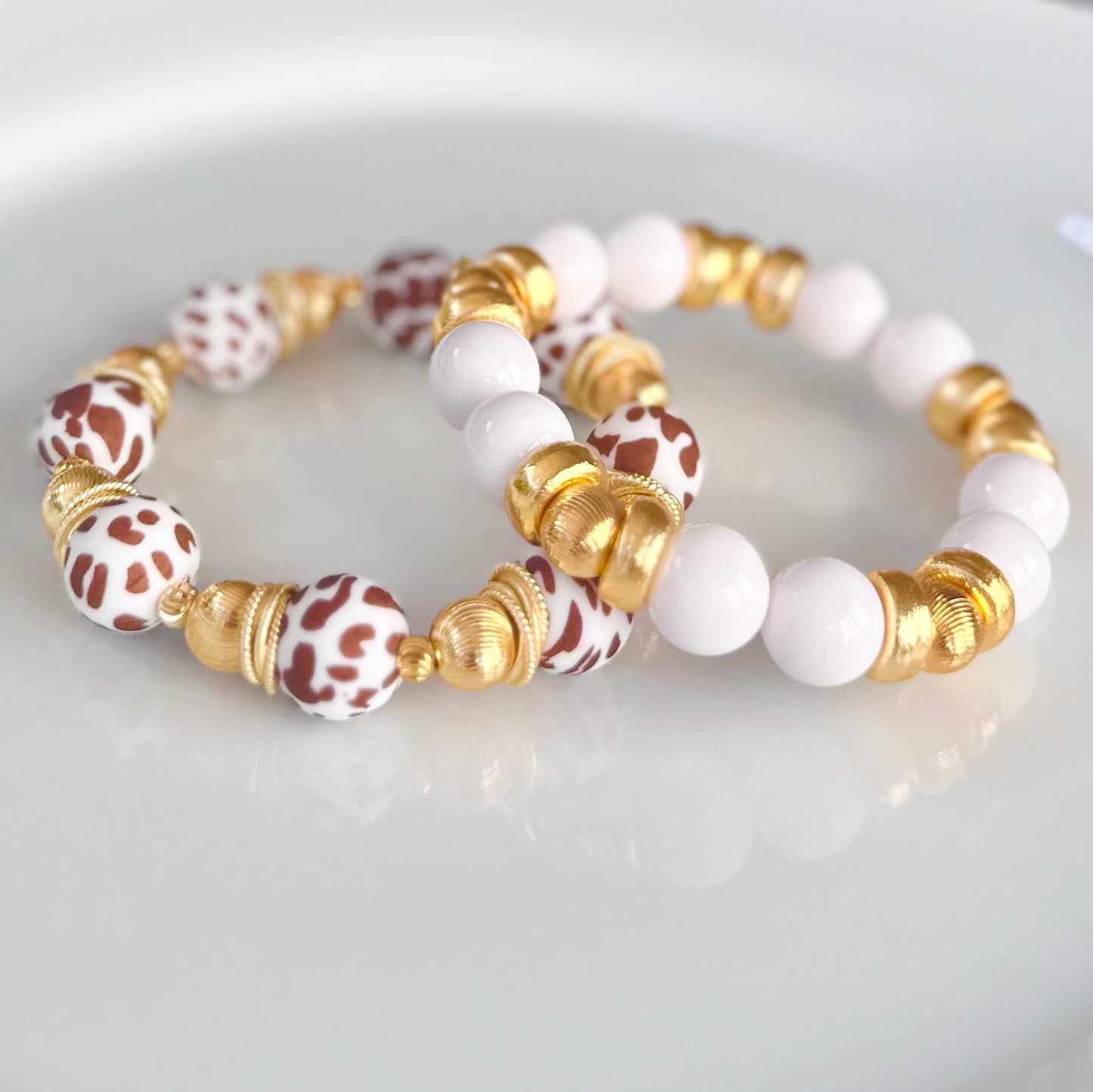 BROWN AND WHITE COW PATTERN BANGLE WITH GOLD ACCENTS