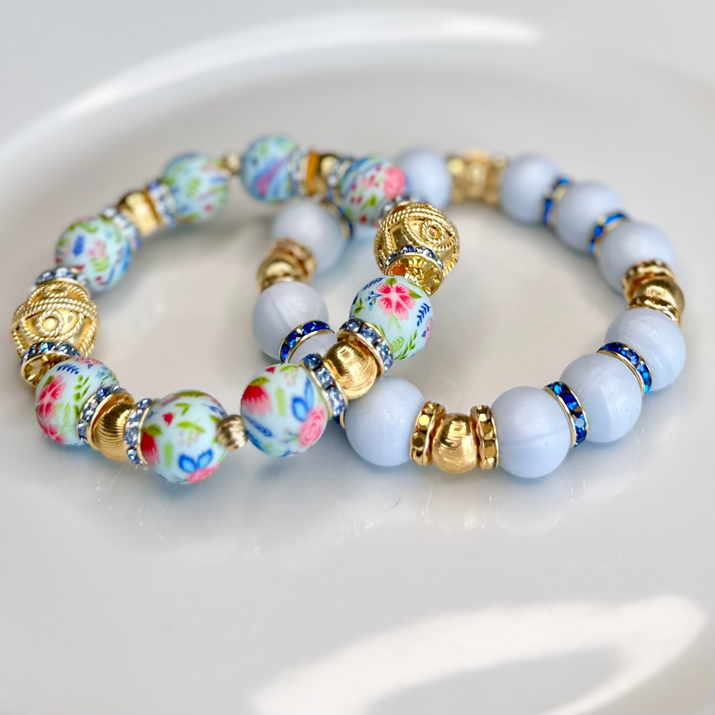 LIGHT BLUE FLOWER AND TEXTURED SWIRL GOLD BANGLE WITH  GOLD AND CZ BANGLE